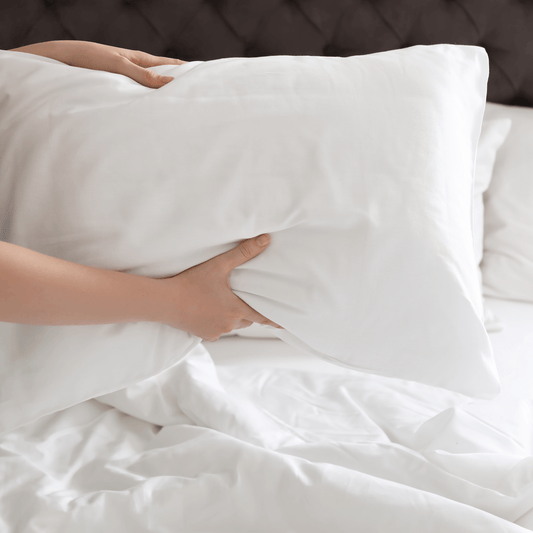 Reshape your Body Pillow - A woman reshaping a pillow | Sanggolcomfort