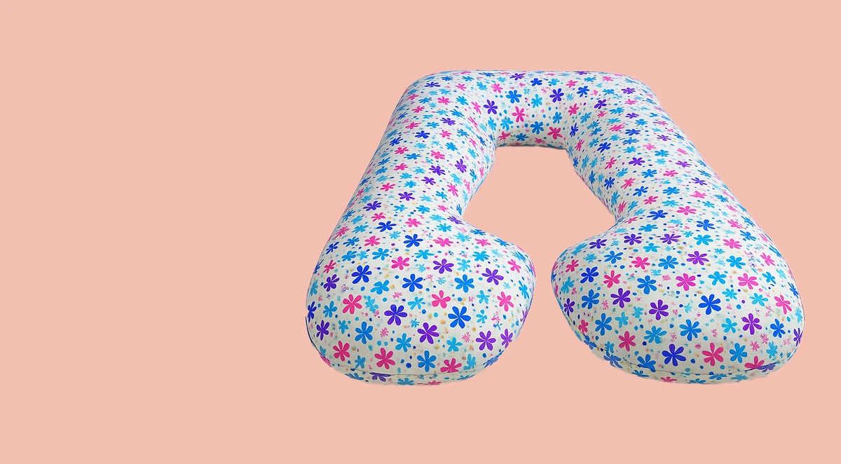 U-shaped pillow with floral pattern on a pink background | Sanggol of sanggolcomfrort.com